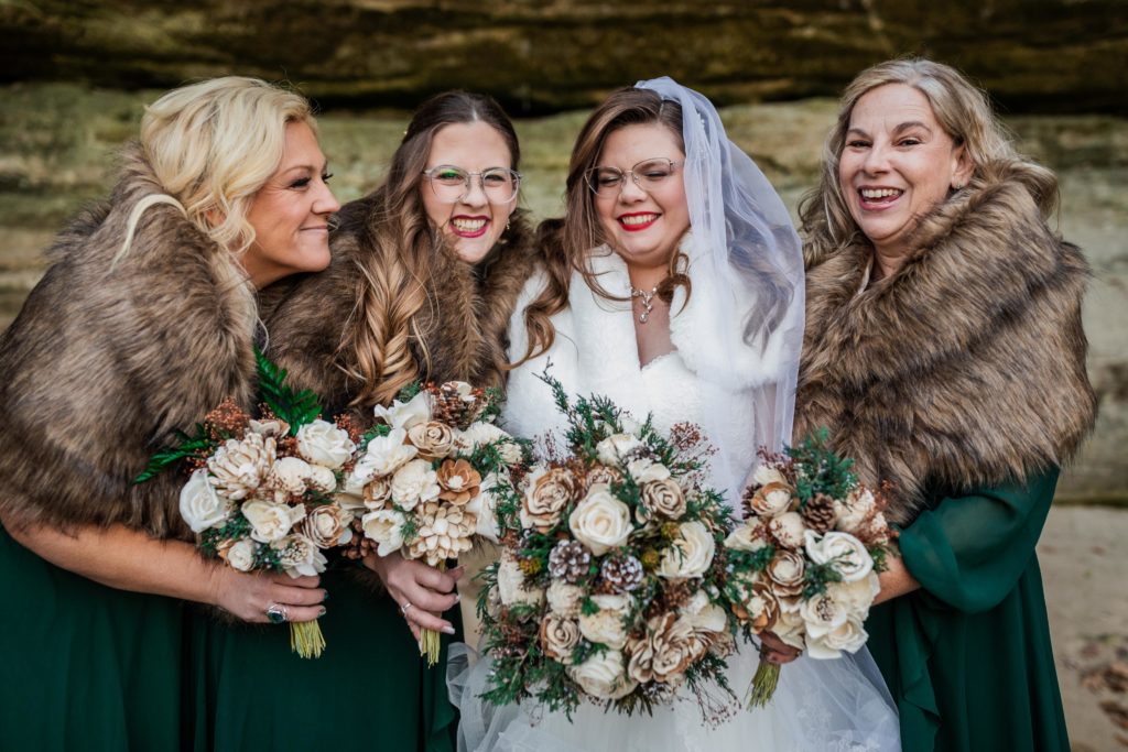 Bride laughs with her friends at Starved Rock