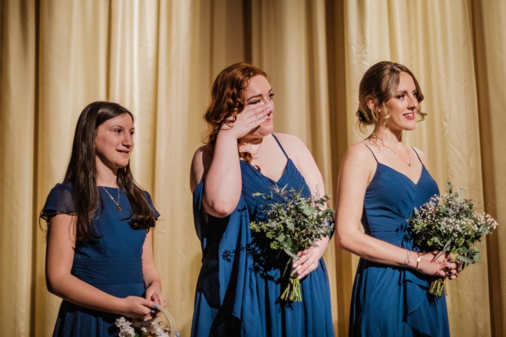 Sister of the bride cries during the wedding at Ovation Chicago