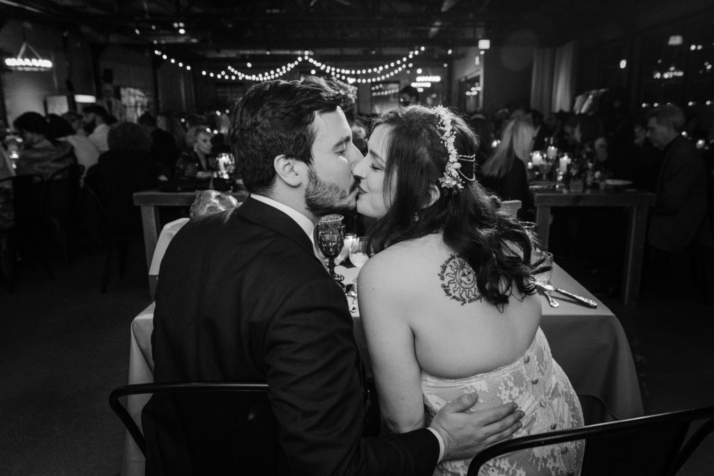 Couple kissing at their table at Ovation Chicago