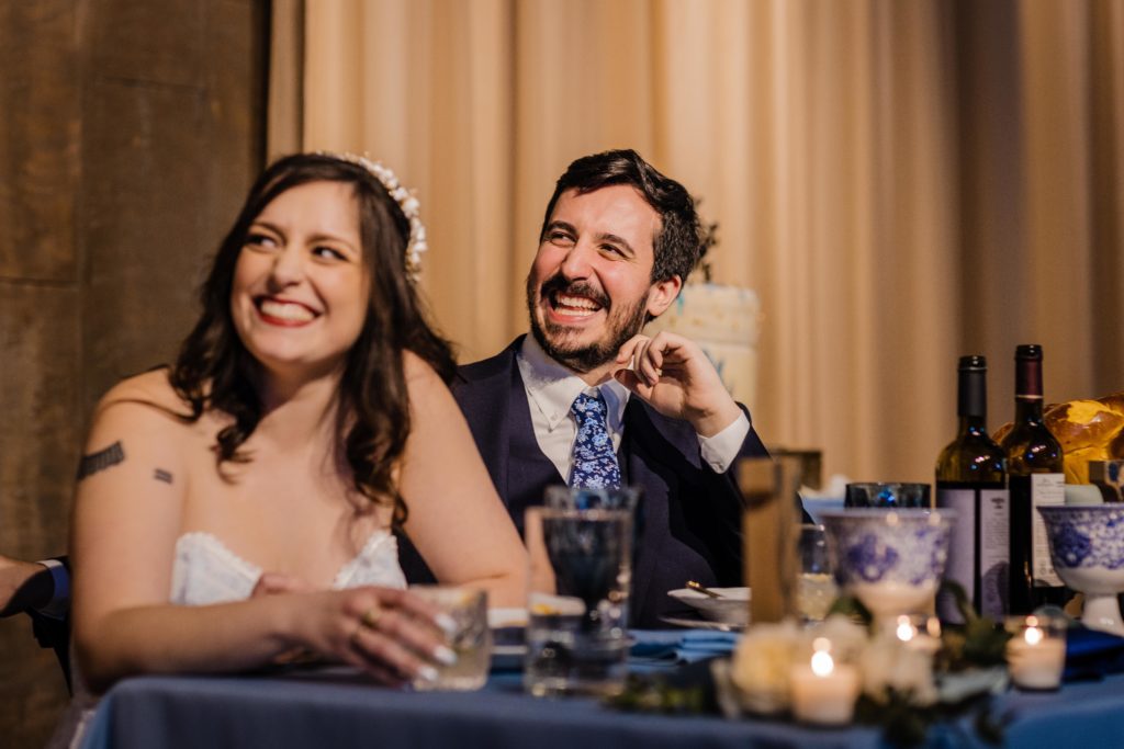Couple laugh while listening to best man's speech at Ovation Chicago