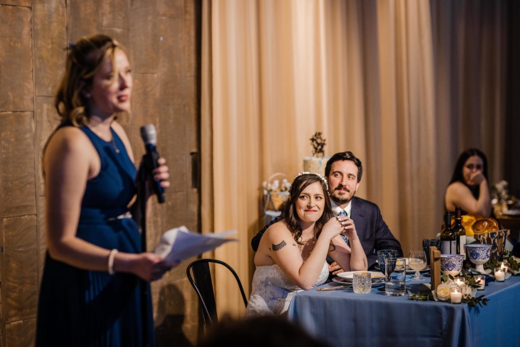 Maid of honor gives a speech while the couple watches at Ovation Chicago