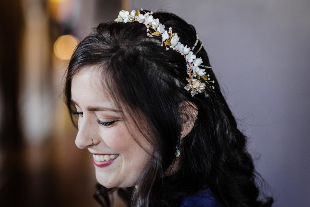 Bride shows off her headpiece 