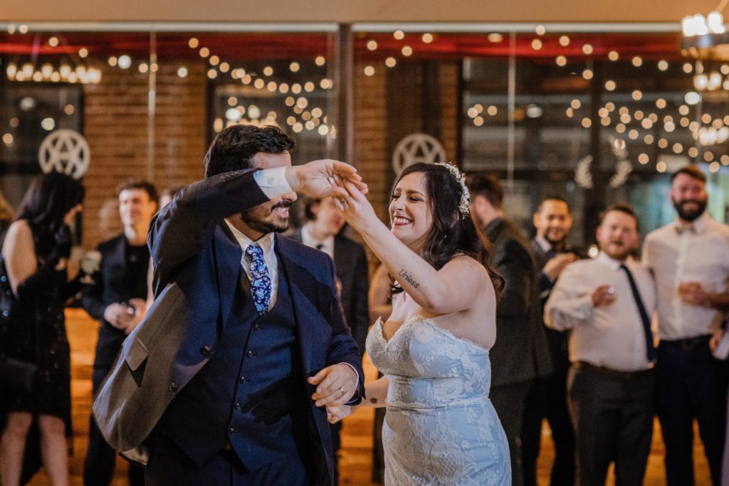 Bride spins groom during their first dance at Ovation Chicago