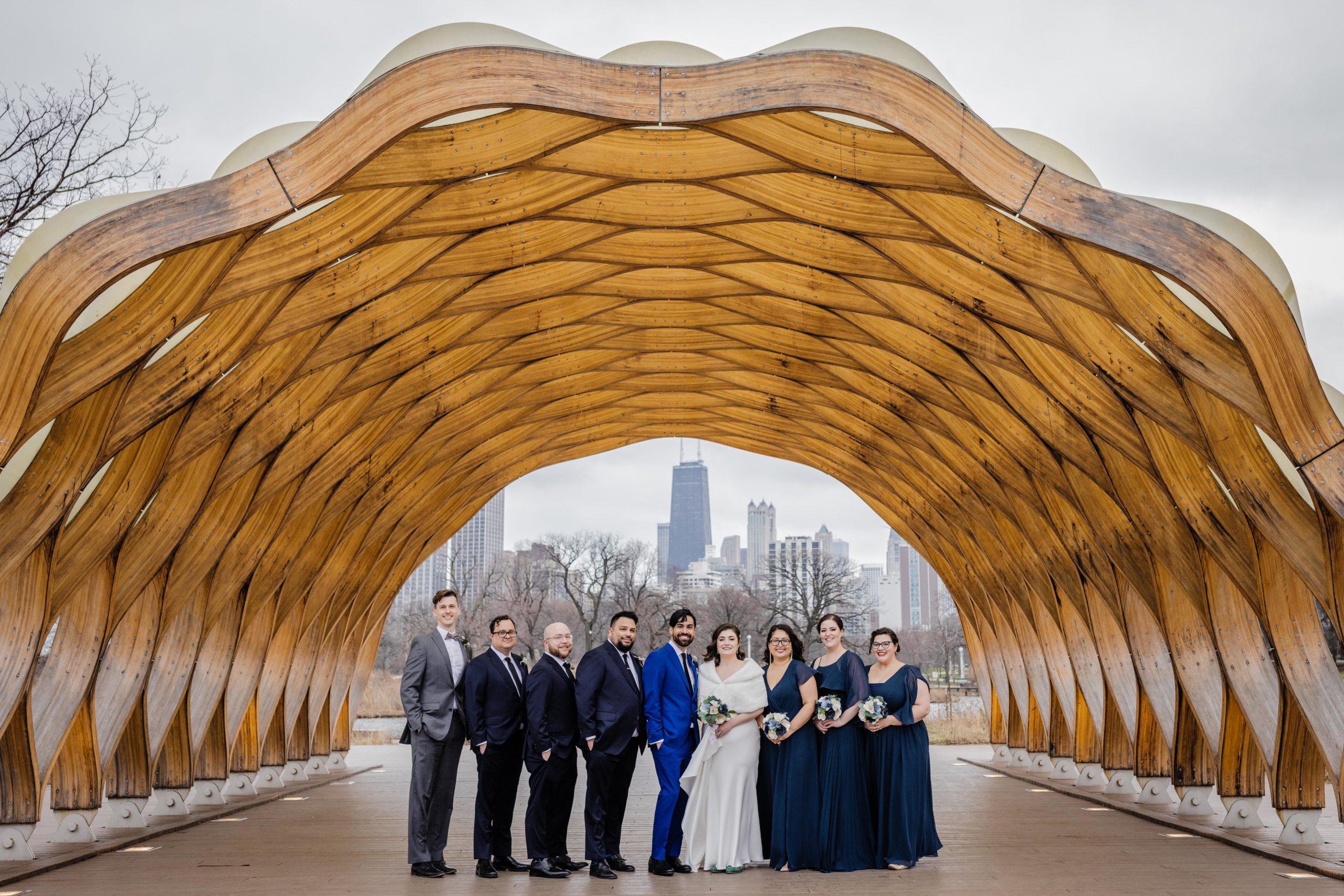 Wedding party posing under the Honeycomb in Lincoln Park