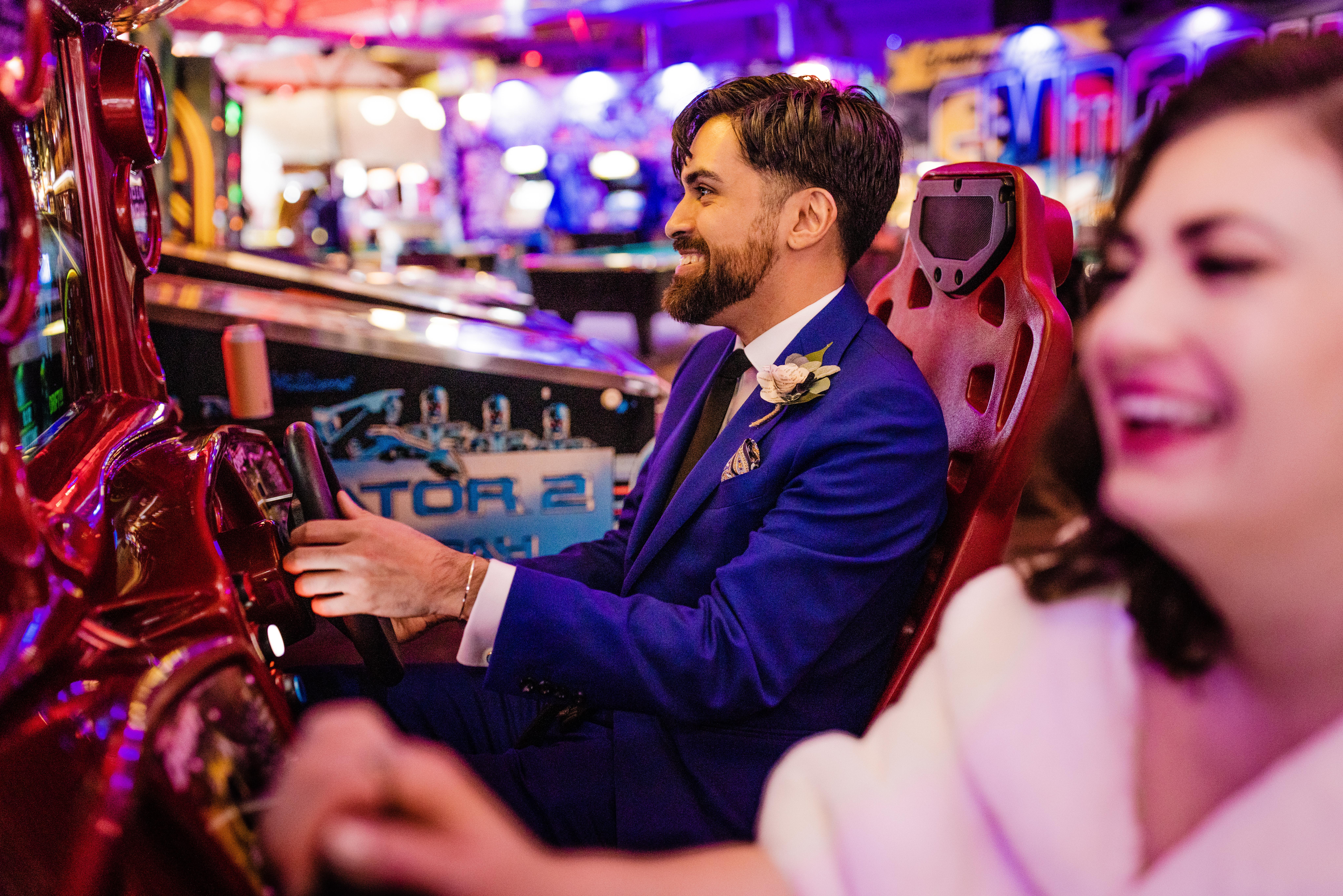 Groom playing driving video game