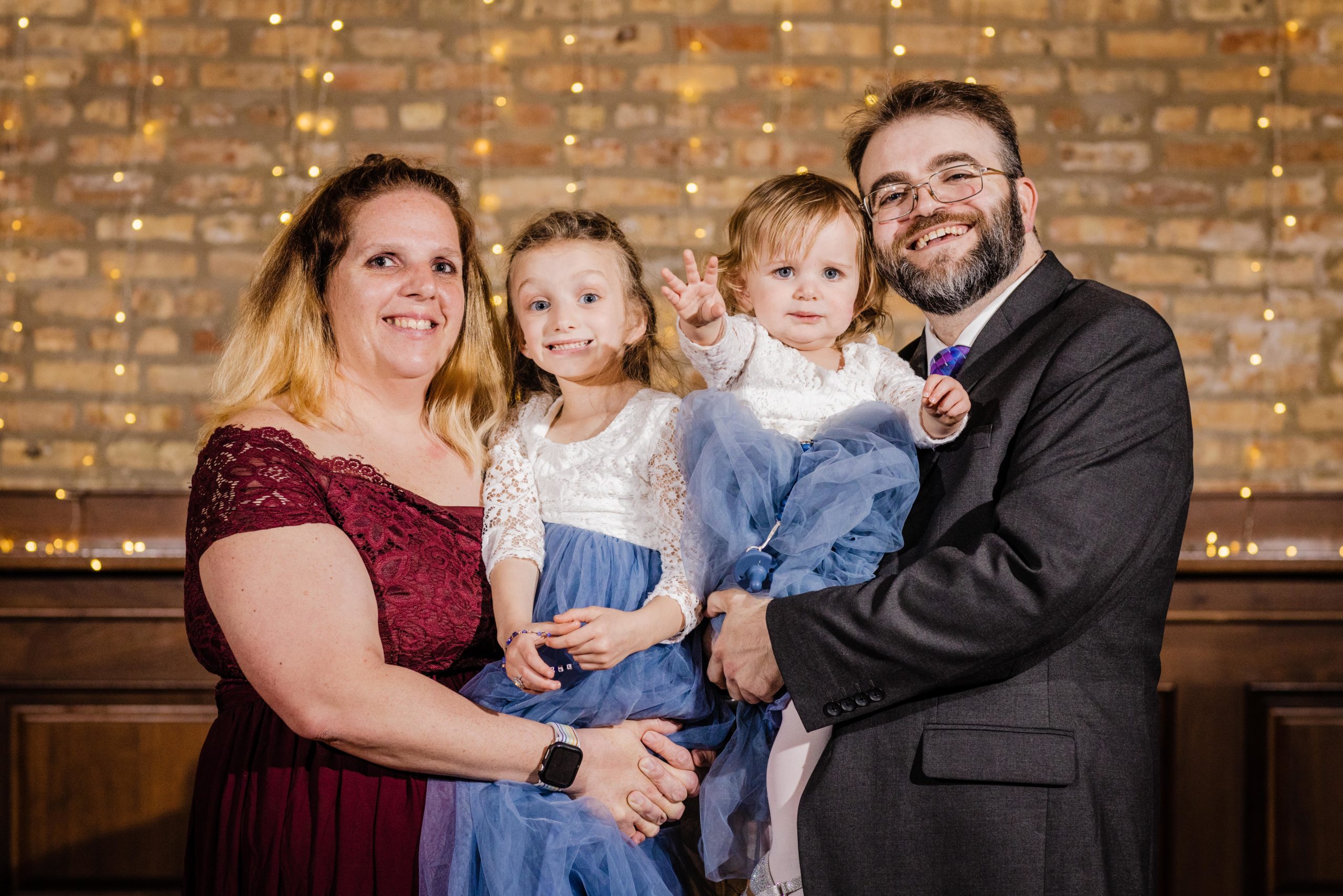 Bride's family poses for a photo at a Revolution Brewing Wedding