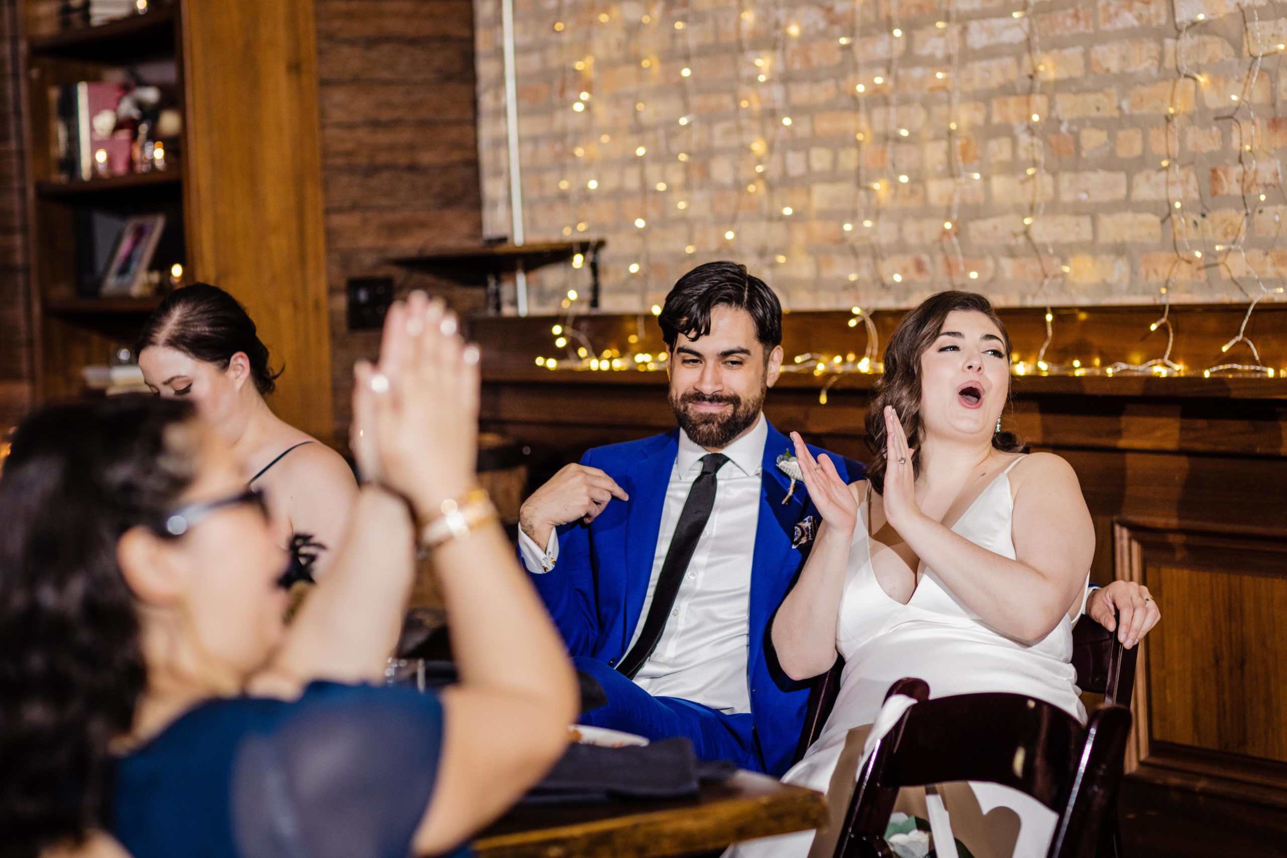 Couple applauding at their Revolution Brewing Wedding