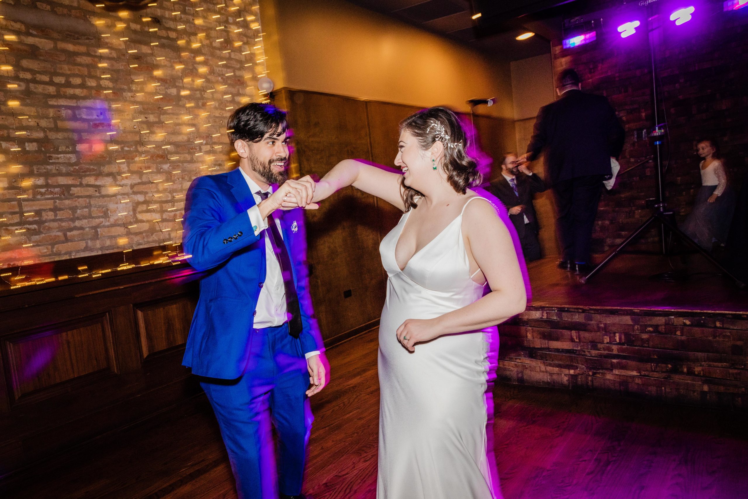 Groom dances with bride at Revolution Brewing Wedding