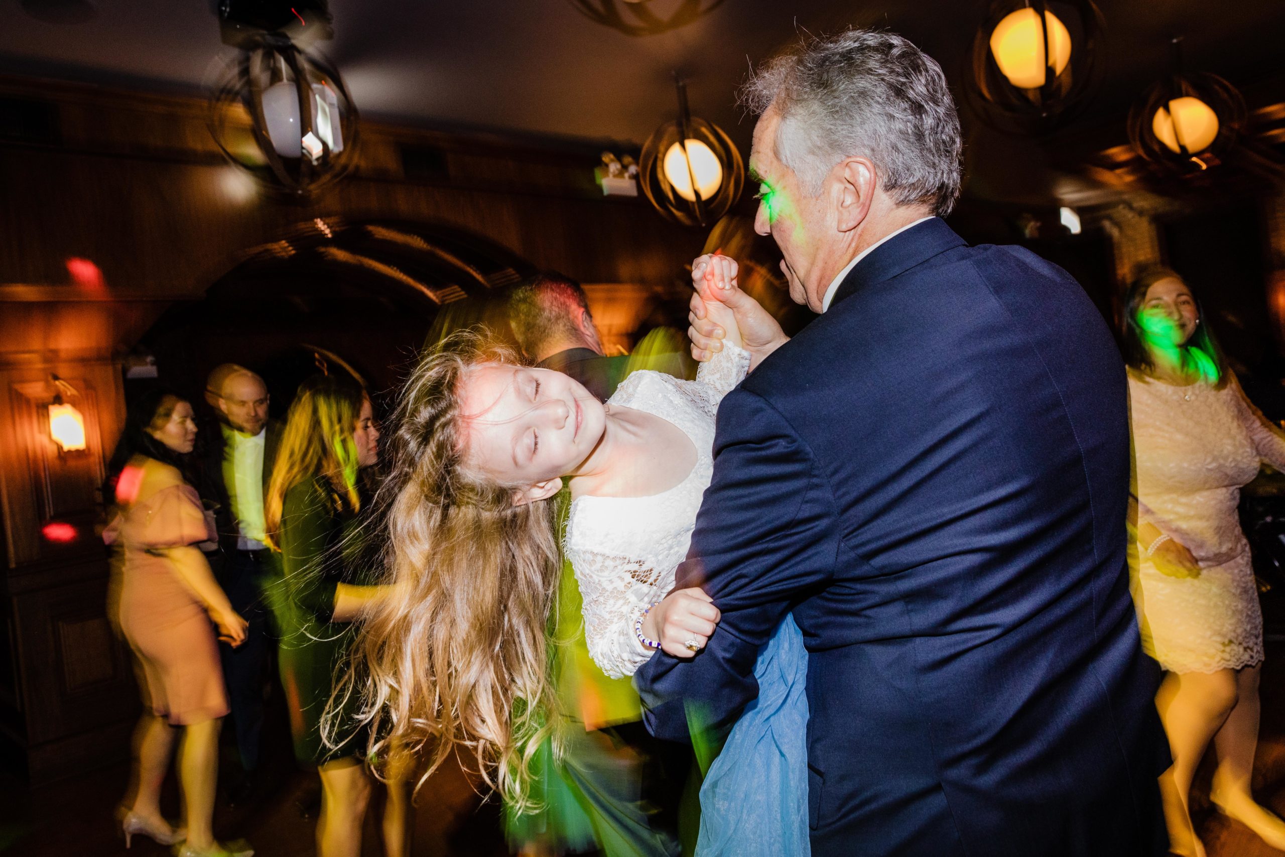 Bride's dad dancing with his granddaughter at a Revolution Brewing Wedding