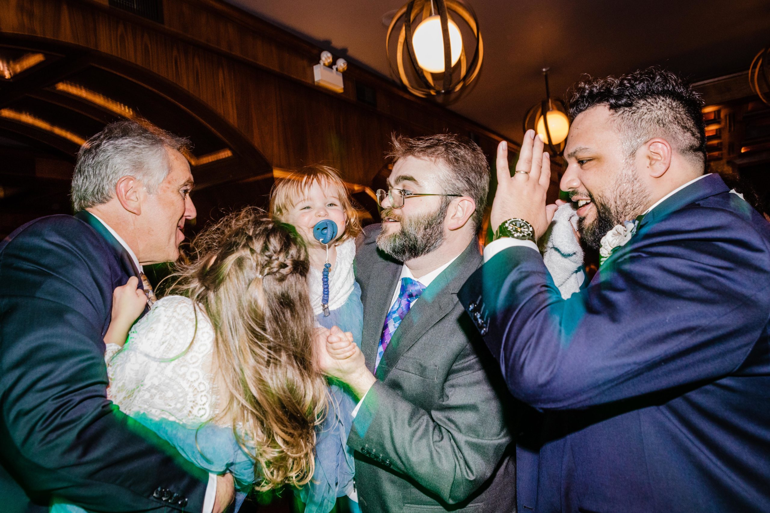 Family dancing together at a Revolution Brewing Wedding