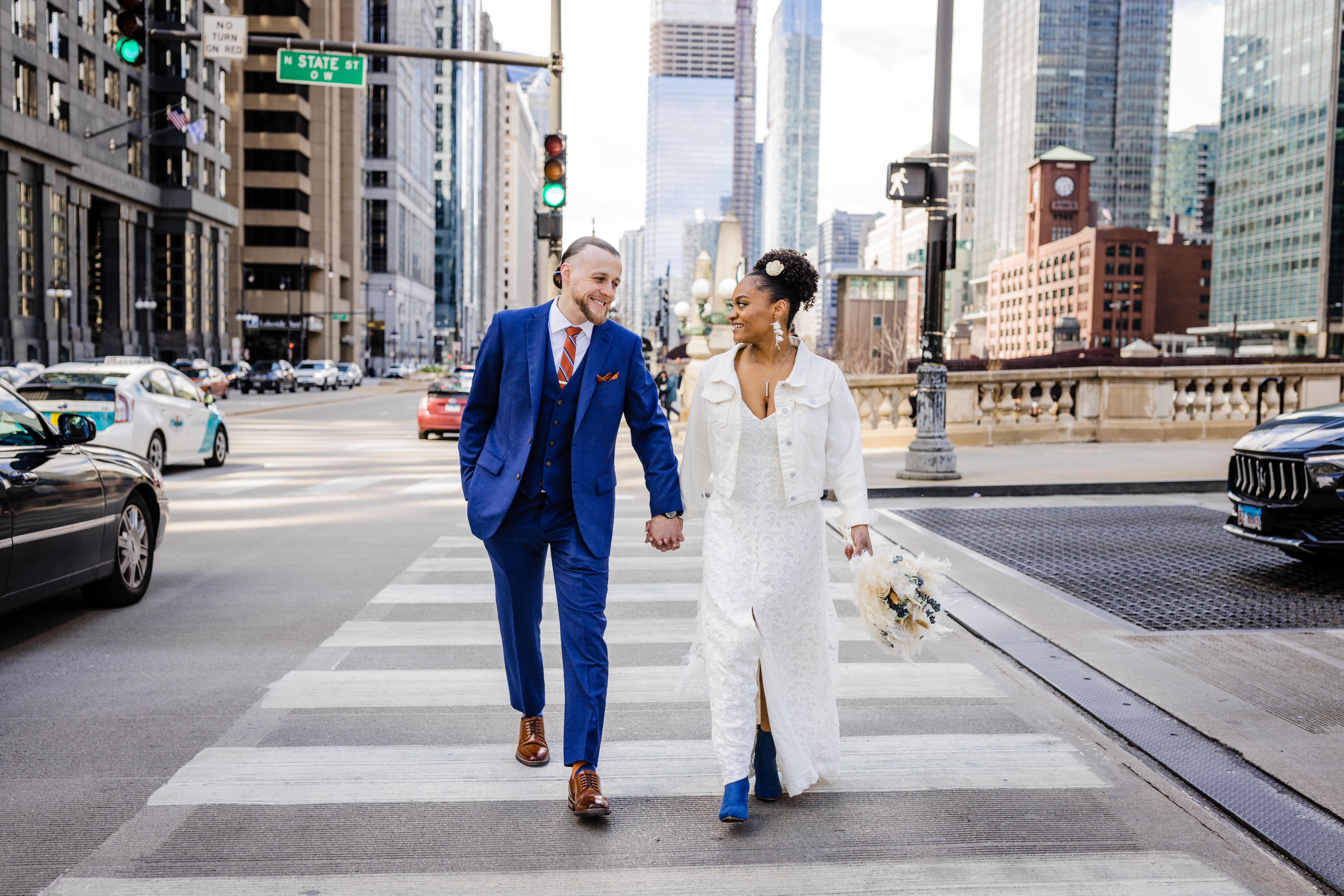 Couple walking across the street in downtown Chicago before their Bottom Lounge wedding