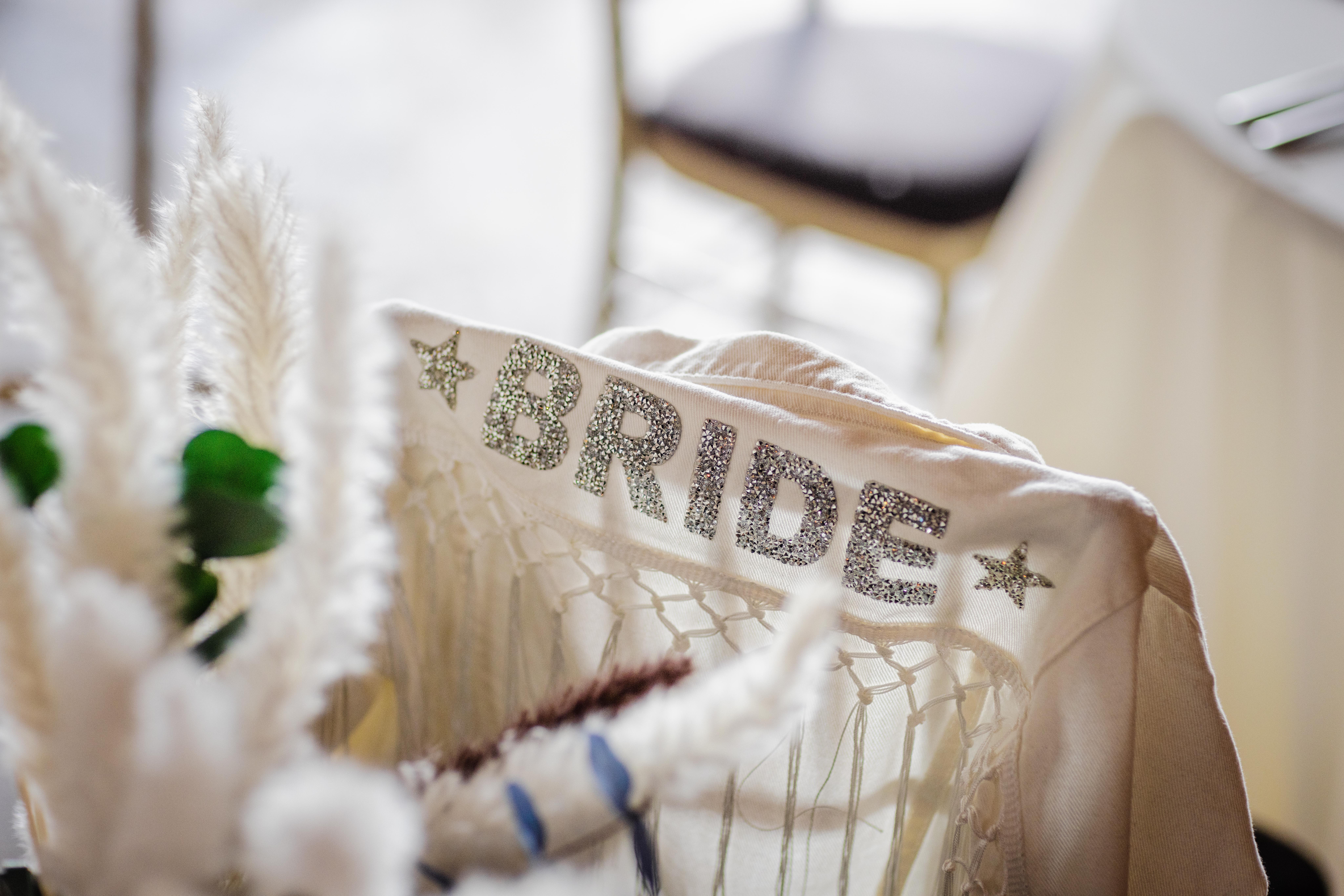 Back of bride's jacket on a chair at her Bottom Lounge Wedding