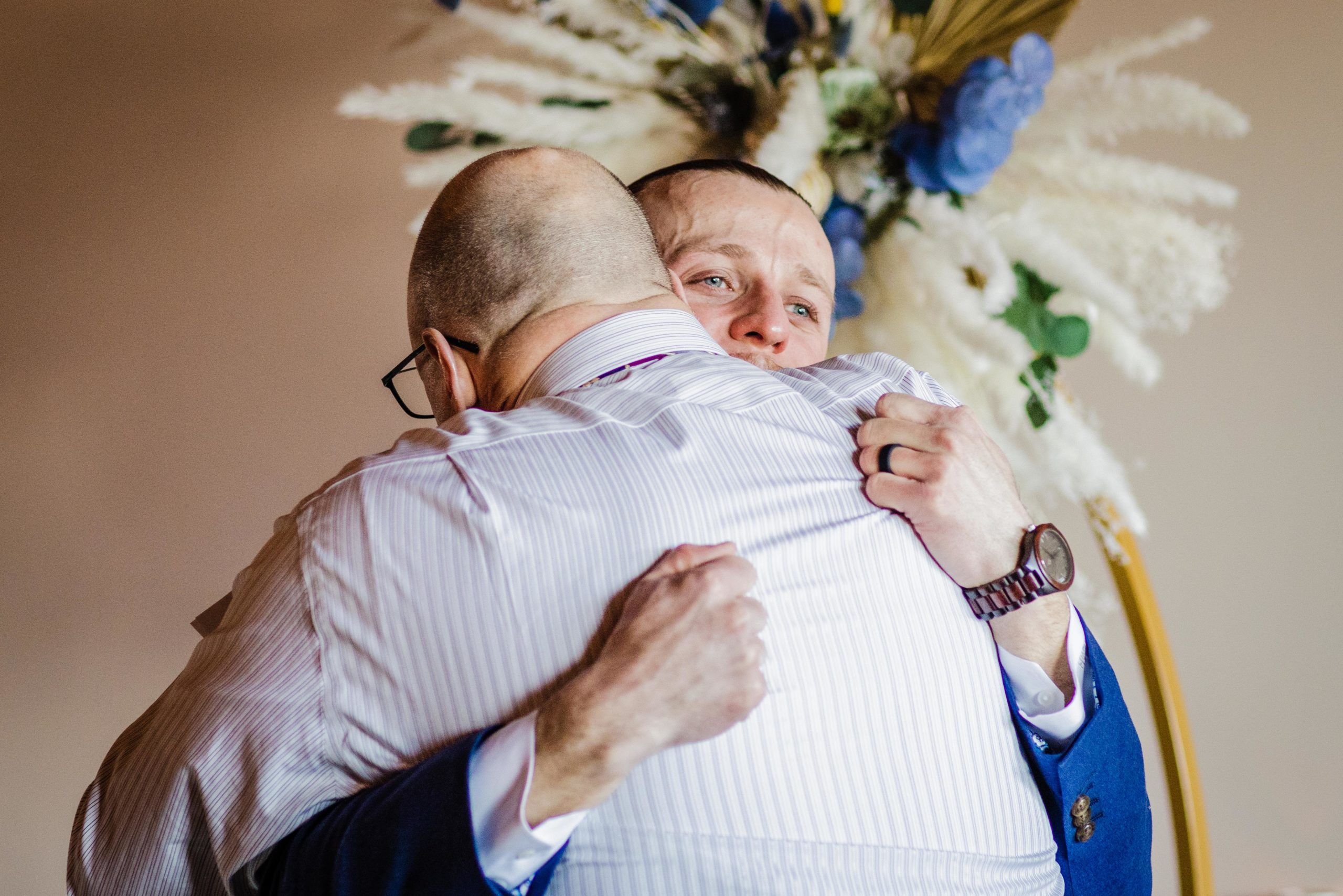 Groom hugs his father at his Bottom Lounge Wedding