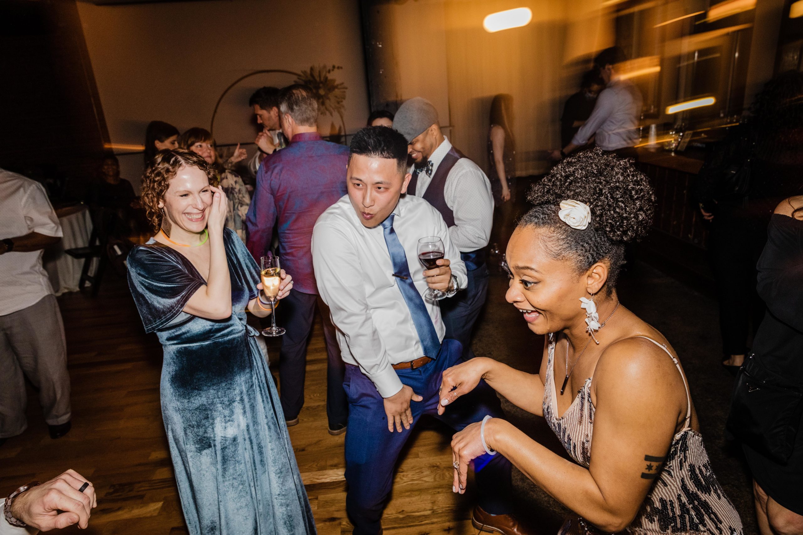 Friends laughing on the dance floor at a Bottom Lounge Wedding