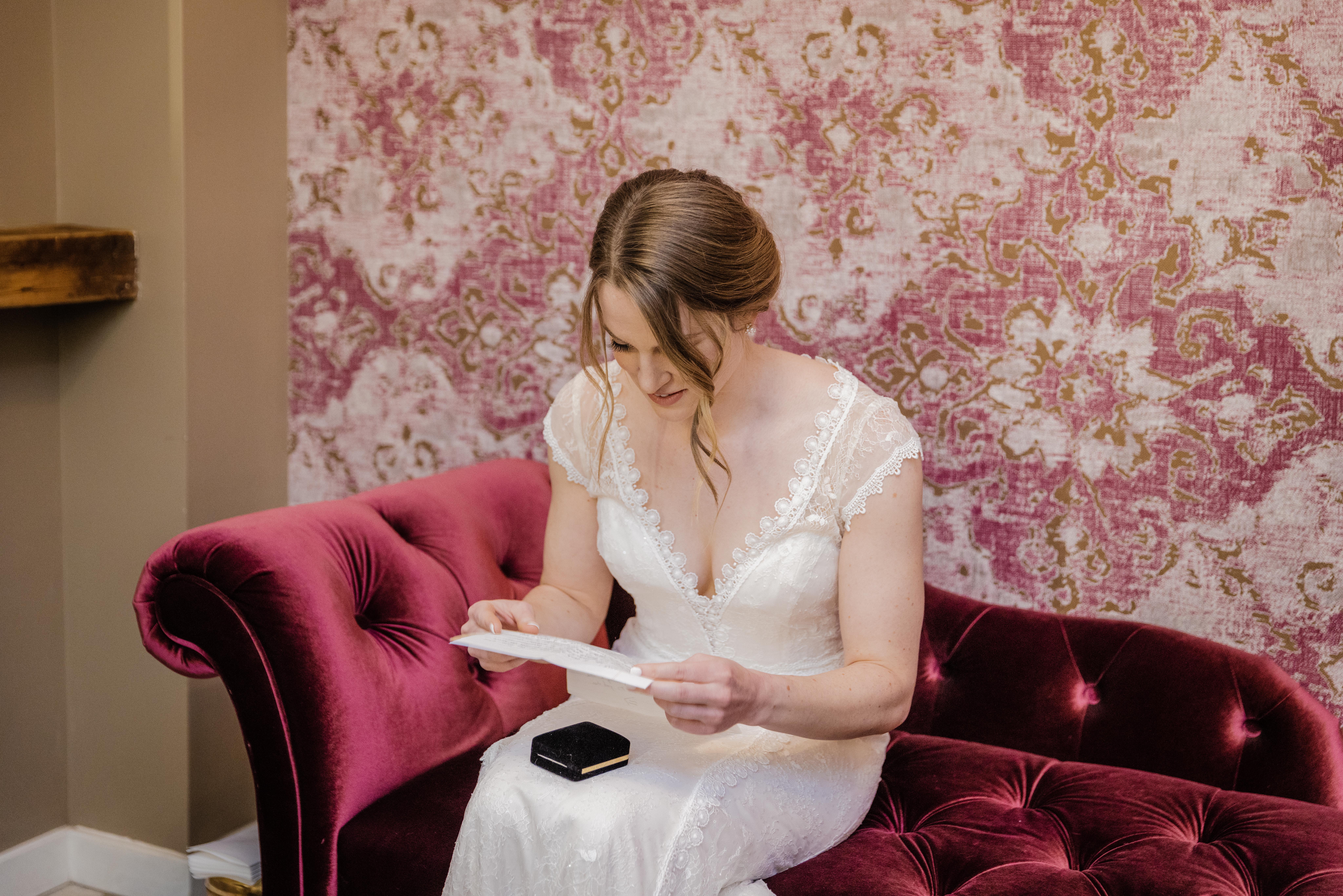 Bride reading a note from her husband