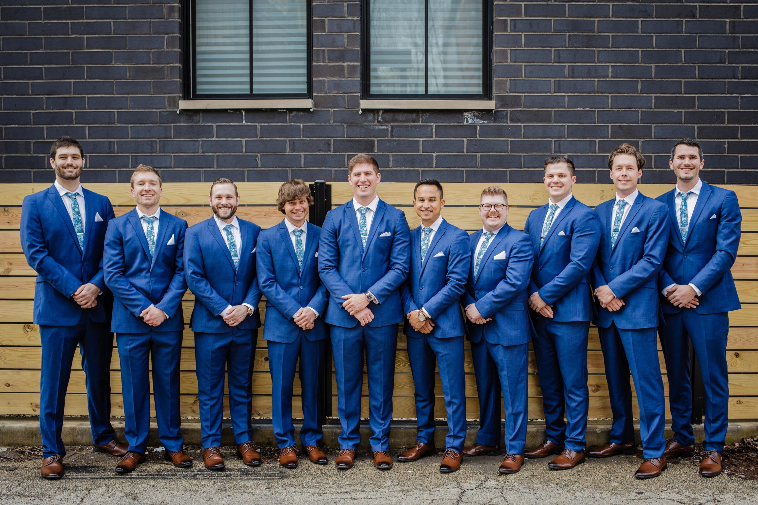 Groom posing for a photo with his groomsmen before his wedding at The Joinery in Chicago